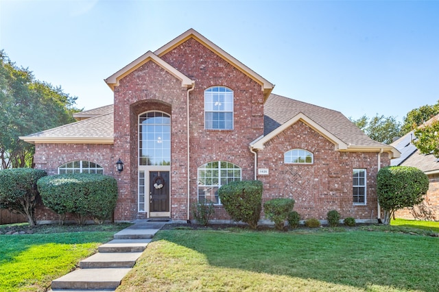 view of property with a front lawn