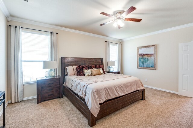 carpeted bedroom featuring multiple windows, ceiling fan, and ornamental molding