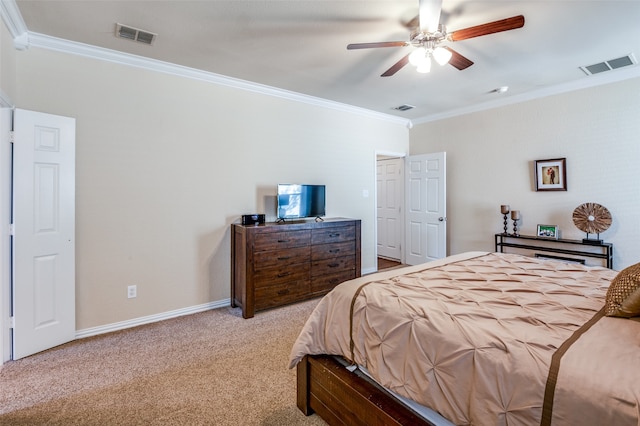 carpeted bedroom with ceiling fan and crown molding