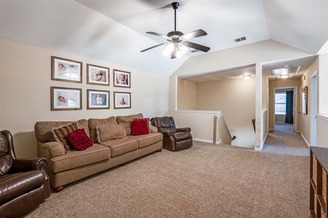 living room with carpet flooring, ceiling fan, and lofted ceiling