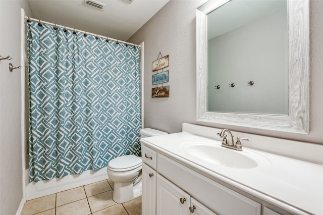 full bathroom featuring tile patterned flooring, vanity, toilet, and shower / bathtub combination with curtain