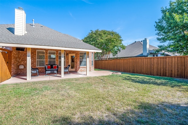 view of yard with outdoor lounge area and a patio