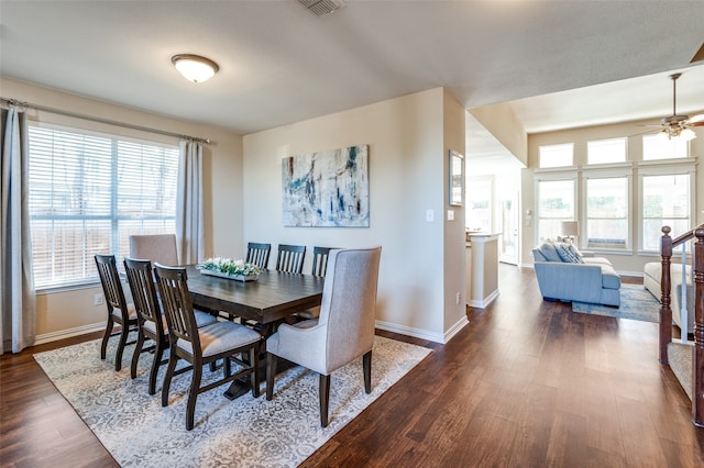 dining area featuring ceiling fan and dark wood-type flooring