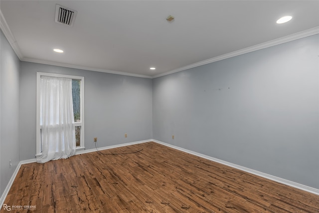 unfurnished room with wood-type flooring and ornamental molding