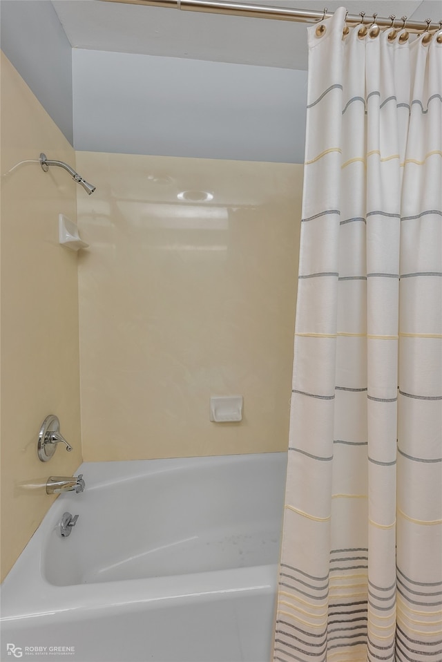 bathroom featuring shower / bath combination with curtain