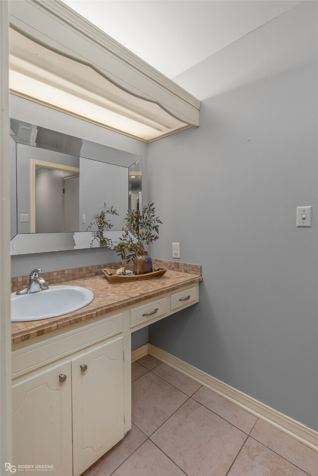 bathroom with tile patterned flooring and vanity