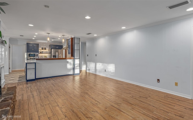 living room with light hardwood / wood-style floors and ornamental molding