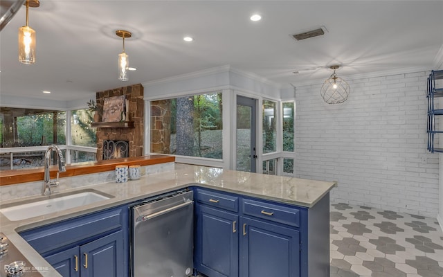 kitchen with a wealth of natural light, sink, crown molding, and blue cabinets