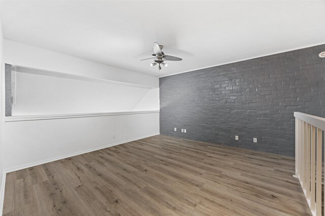 stairway featuring hardwood / wood-style floors and ceiling fan