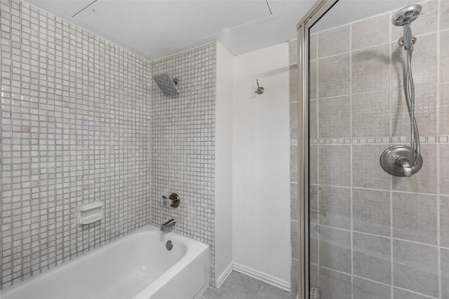 bathroom with tile patterned flooring and tiled shower / bath combo