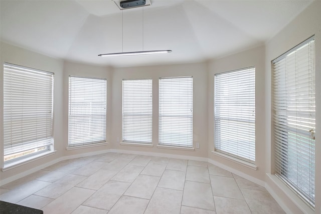 unfurnished sunroom with a wealth of natural light