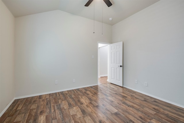 spare room featuring ceiling fan, dark hardwood / wood-style flooring, and high vaulted ceiling