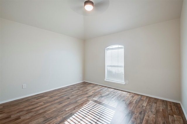 unfurnished room featuring dark hardwood / wood-style floors and ceiling fan