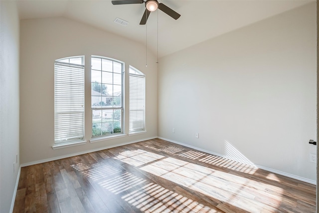 unfurnished room with ceiling fan, wood-type flooring, and lofted ceiling