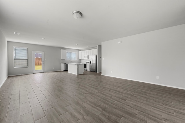 unfurnished living room with hardwood / wood-style floors