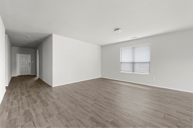 spare room featuring light wood-type flooring