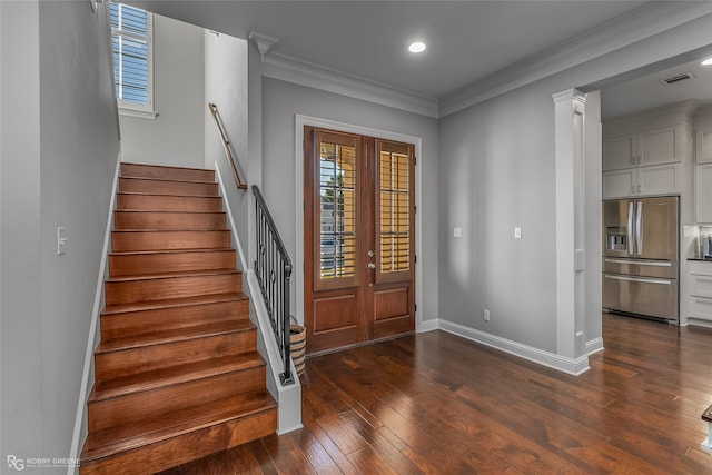 entryway featuring french doors, dark hardwood / wood-style floors, and ornamental molding