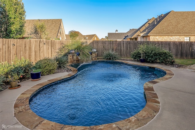 view of swimming pool featuring pool water feature