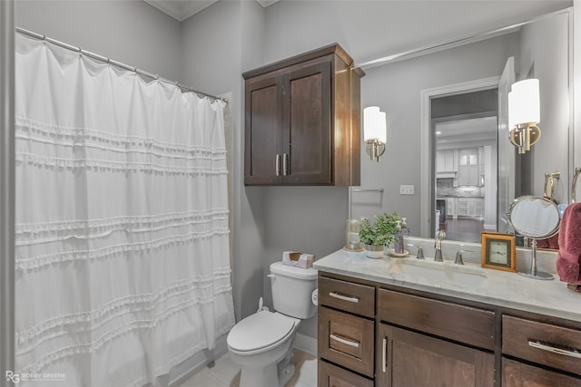 bathroom with a shower with shower curtain, vanity, crown molding, tile patterned flooring, and toilet