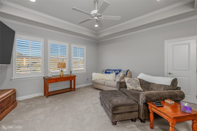 living room featuring light carpet, ceiling fan, and ornamental molding