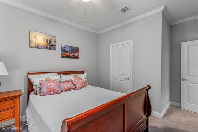 carpeted bedroom with ornamental molding, visible vents, ceiling fan, and baseboards