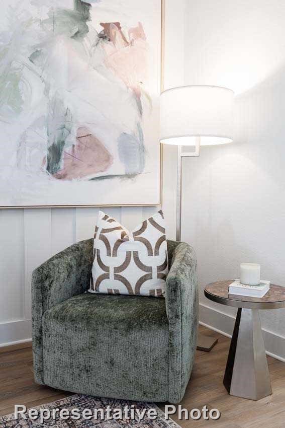 sitting room with hardwood / wood-style flooring