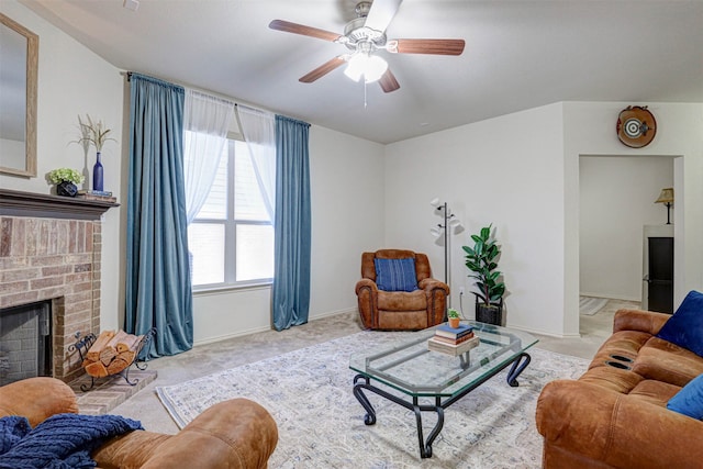 carpeted living room with ceiling fan and a fireplace