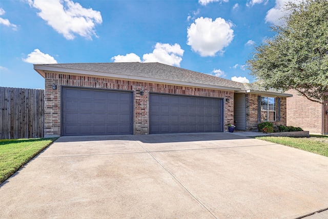 single story home featuring a garage