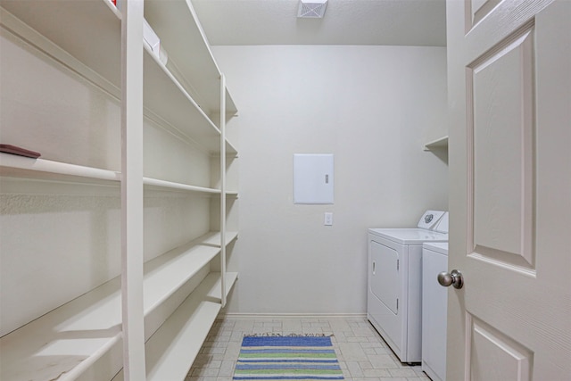 washroom featuring washer and clothes dryer