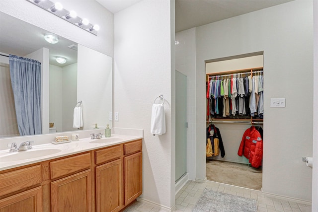 bathroom featuring vanity and a shower