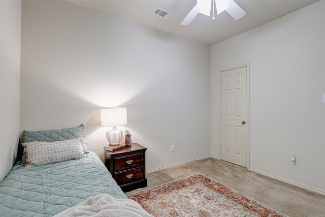 bedroom with ceiling fan and light carpet