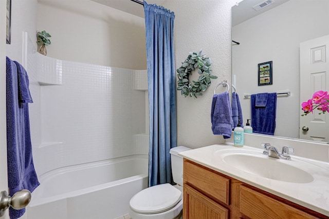 full bathroom featuring vanity, shower / tub combo, and toilet