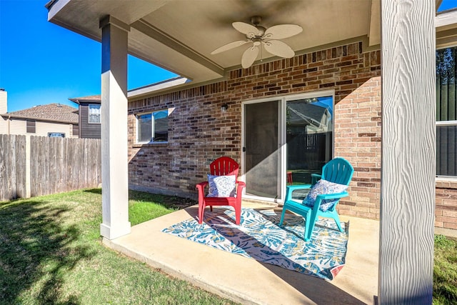 view of patio featuring ceiling fan