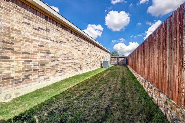 view of yard featuring central AC