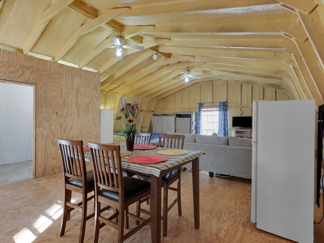 dining area featuring vaulted ceiling and ceiling fan