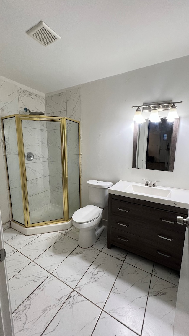 bathroom with vanity, toilet, and walk in shower