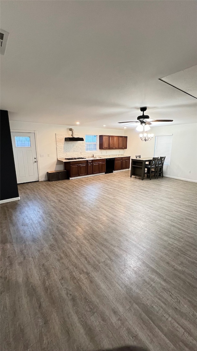 unfurnished living room featuring ceiling fan and dark wood-type flooring