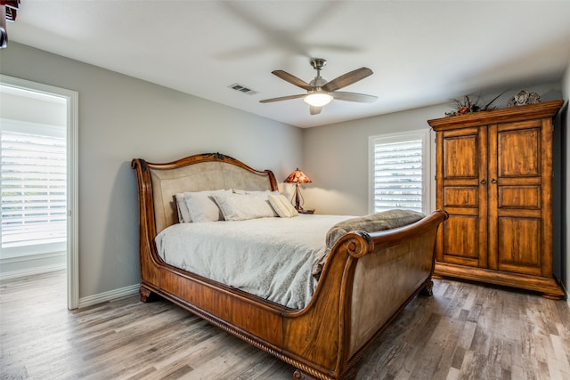 bedroom featuring hardwood / wood-style flooring and ceiling fan