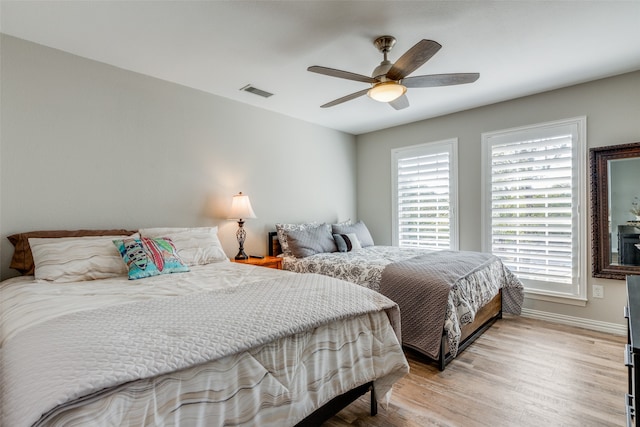 bedroom featuring ceiling fan and light hardwood / wood-style flooring