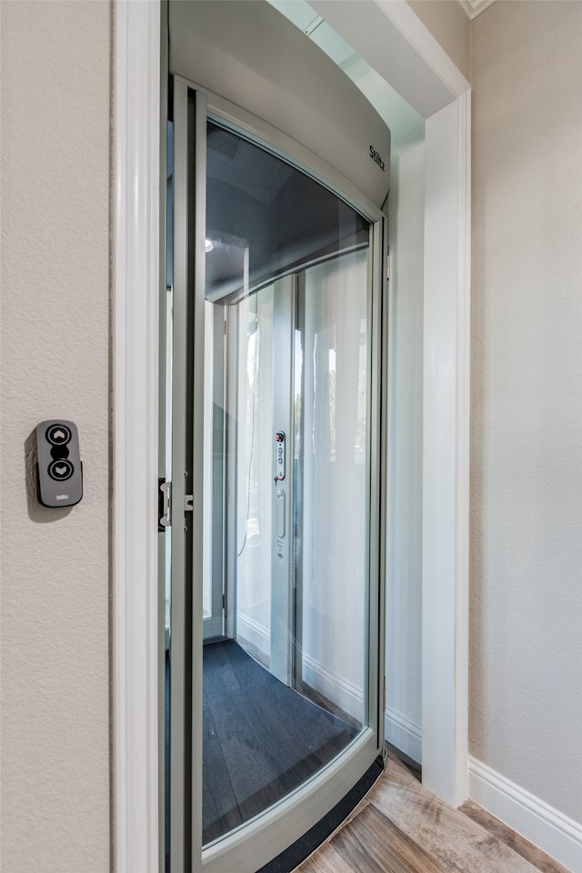 bathroom with wood-type flooring