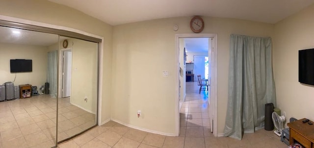 hallway featuring light tile patterned floors