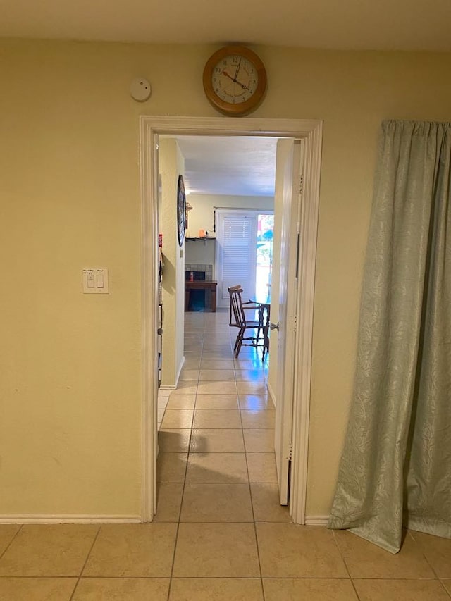 corridor featuring light tile patterned flooring