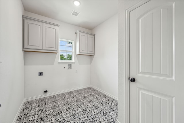 laundry room with cabinets, hookup for a washing machine, and electric dryer hookup