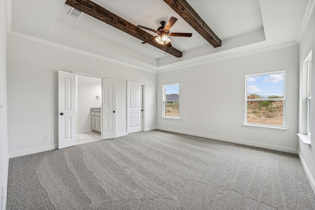 unfurnished bedroom with beam ceiling, connected bathroom, ceiling fan, crown molding, and light colored carpet