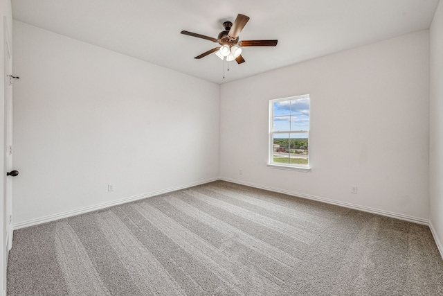 spare room with ceiling fan and carpet floors