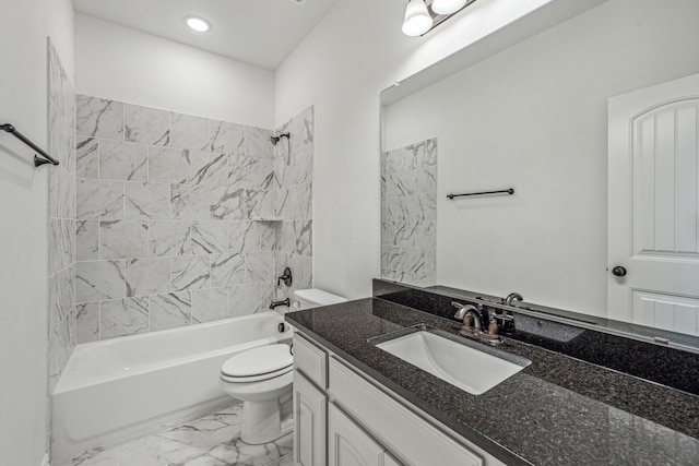 full bathroom with vanity, toilet, and tiled shower / bath