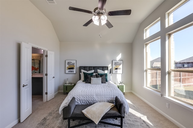 carpeted bedroom with ceiling fan and lofted ceiling