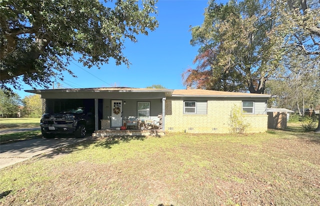 single story home featuring a carport and a front lawn