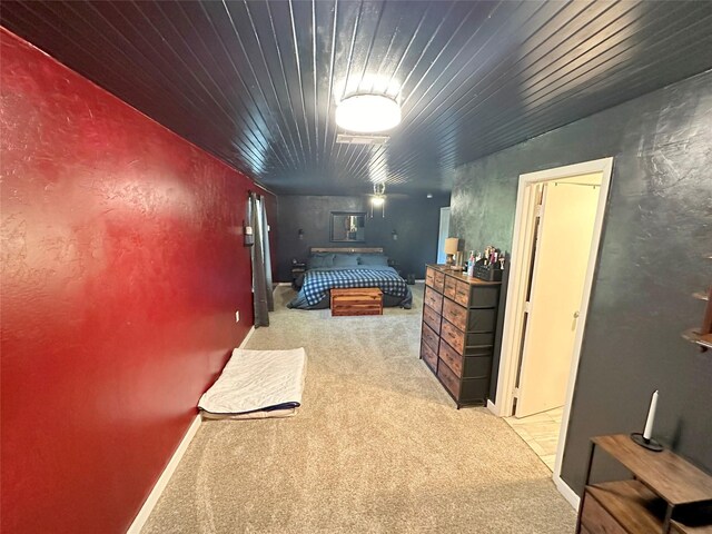 carpeted bedroom featuring wooden ceiling