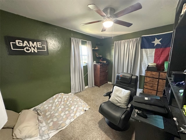 interior space featuring ceiling fan and carpet floors